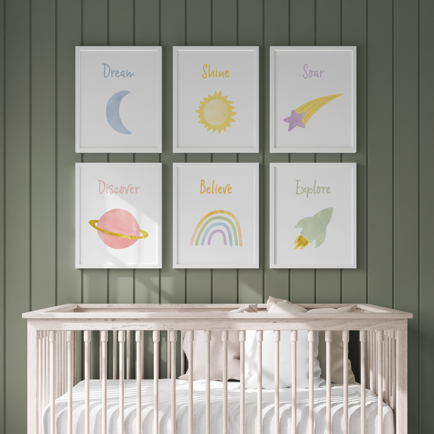 Framed outer space wall art on green wall in baby room