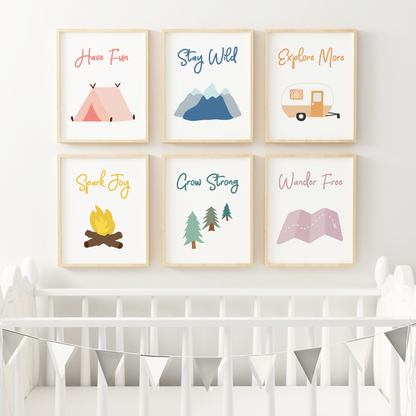 Colorful camping wall art in nursery above crib