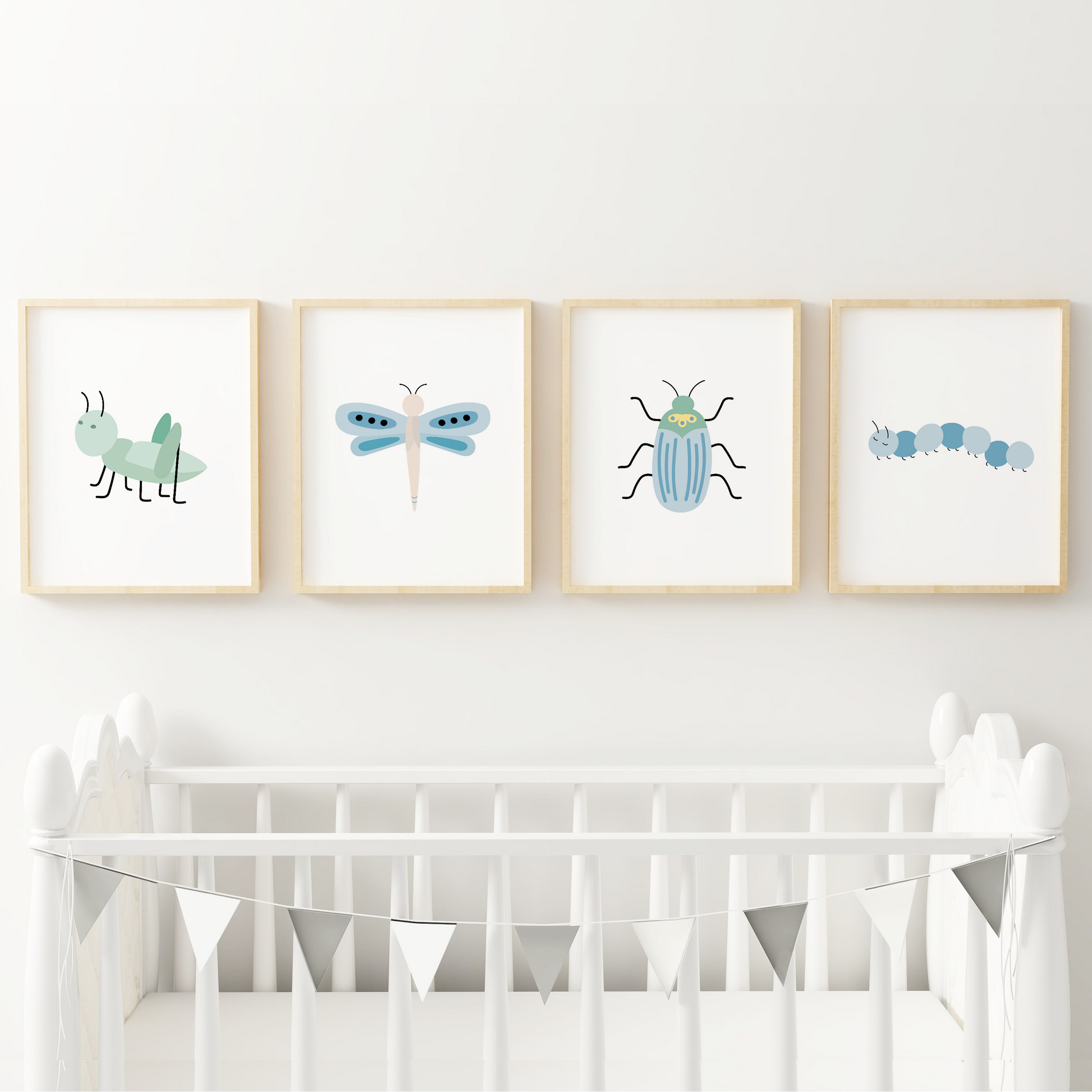 Grasshopper, dragonfly, beetle, and caterpillar nursery artwork above crib