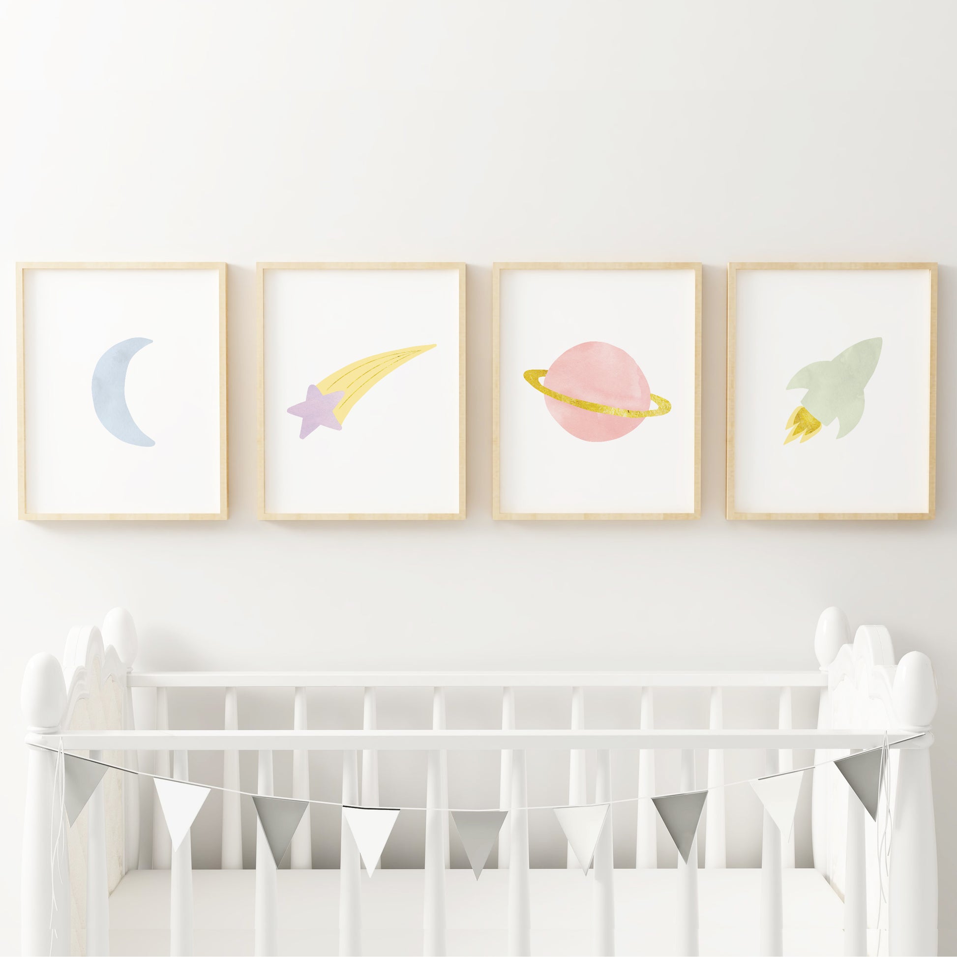 Space themed nursery artwork above crib